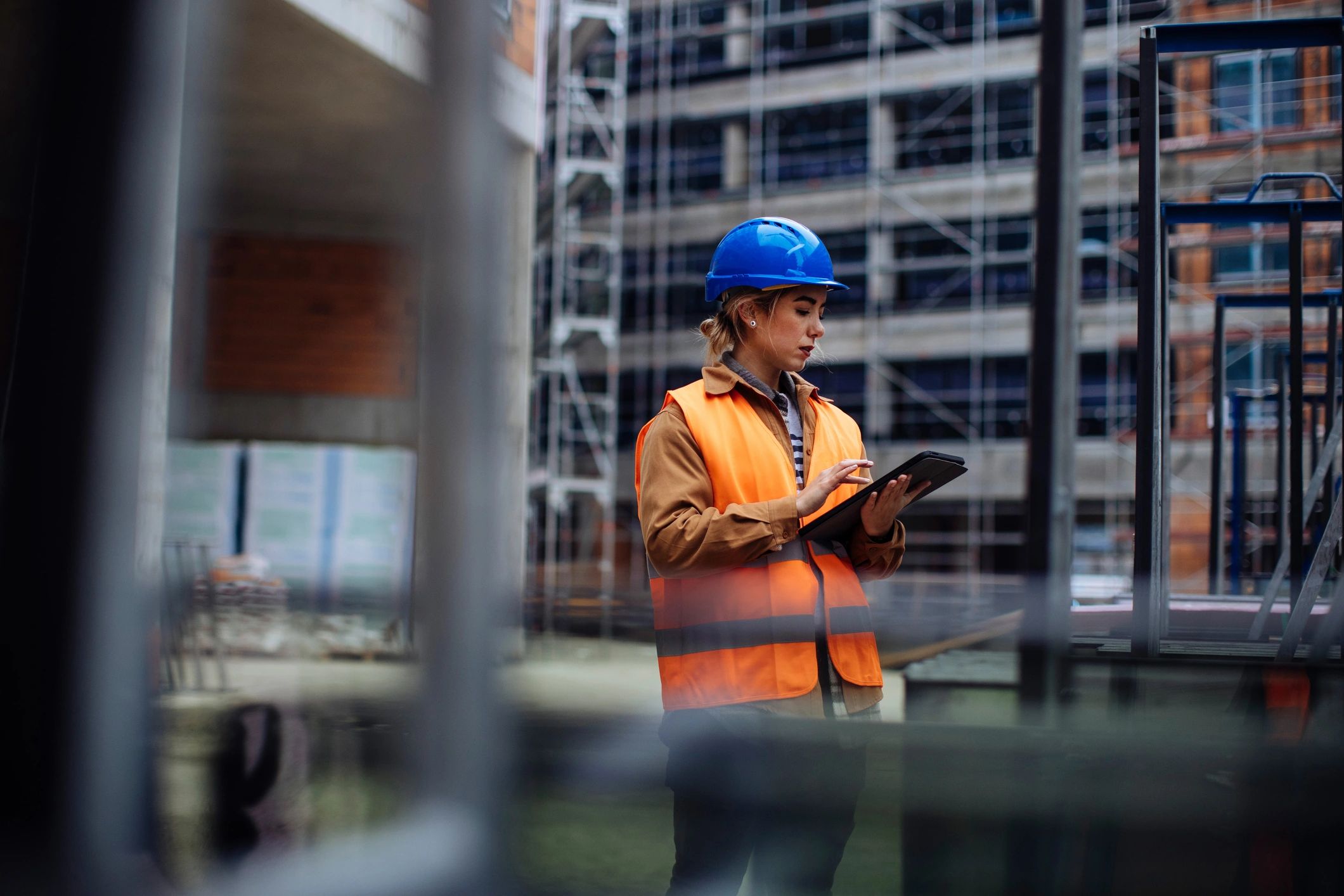 Construction worker using a tablet at a construction site
