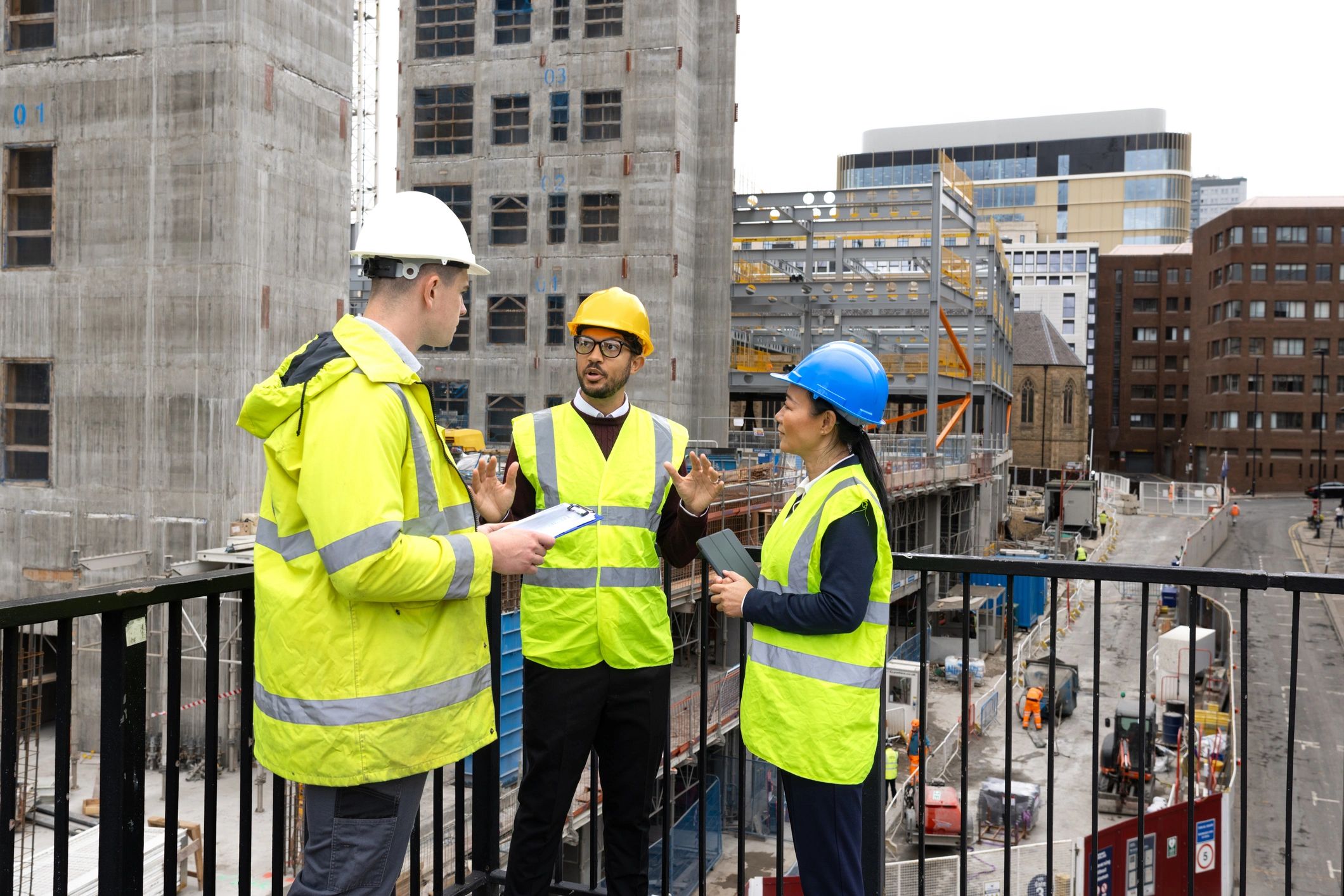 Construction crew reviewing plans at a job site